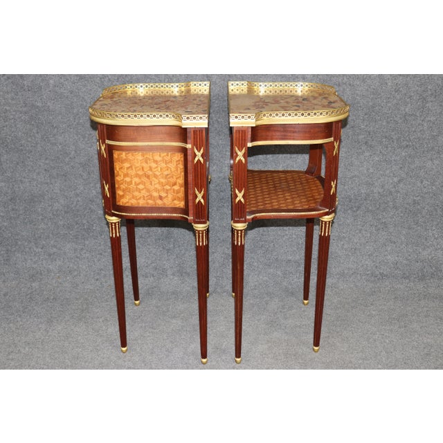 Dimensions: 33.25 inches high x 18.75 inches wide x 14.25 inches deep Remarkably refined pair of antique French Louis XV...