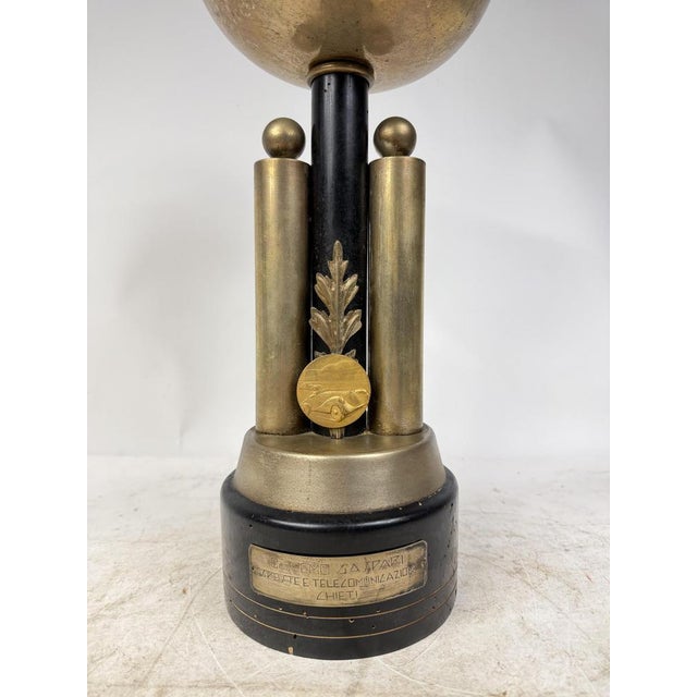 Elegant cup trophy, featuring brass finishes, in perfect 1920s Italian style. Excellent collector's item and decoration.