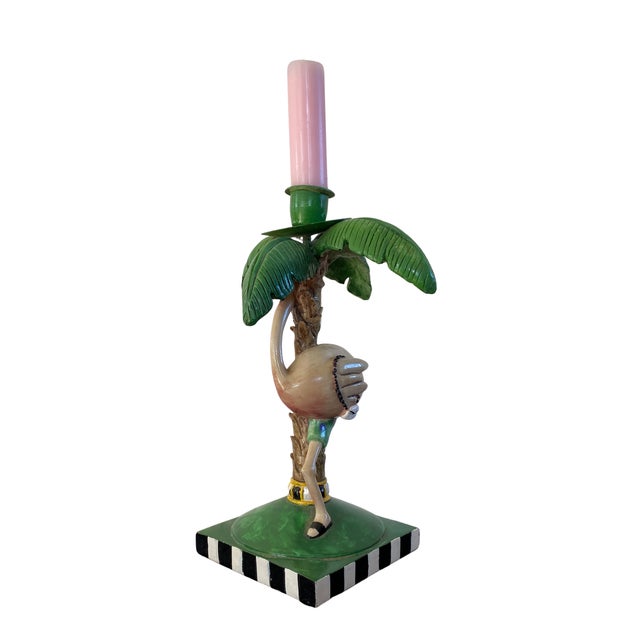 Bring a playful tropical touch to your décor with this whimsical flamingo candle holder. Crafted in hand-painted resin,...