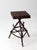 Early 20th century Adirondack twig side table featuring a handcrafted branch base and plank wood top. The intricate...