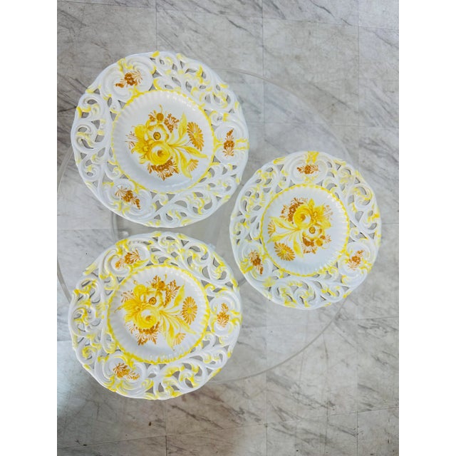 Beautiful, hand painted plates with reticulated edge. Yellow flowers, marked Italy