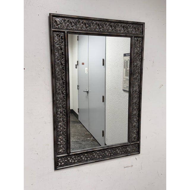 Design Plus Gallery presents a Rectangular Metal Mirror by unknown brand. The ornate metal frame displays layered leaf and...