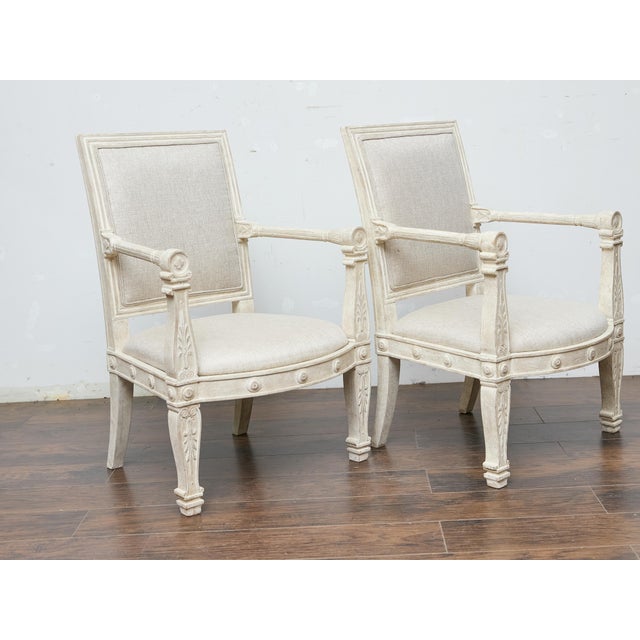 Early 20th Century Pair of French 1920s Painted Armchairs with Carved Details and Linen Upholstery For Sale - Image 5 of 11