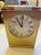An elegant vintage Tiffany & Co. brushed brass desk alarm clock dating to the 1970s, featuring a distinctive half-moon...