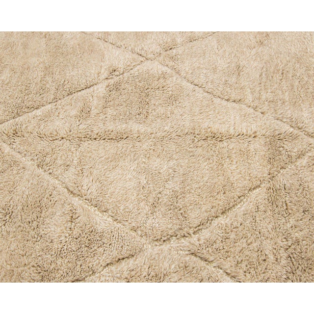 Elegant hand-knotted wool rug, in a versatile Sand hue, showcasing a delicate diamond pattern that adds a touch of modern...