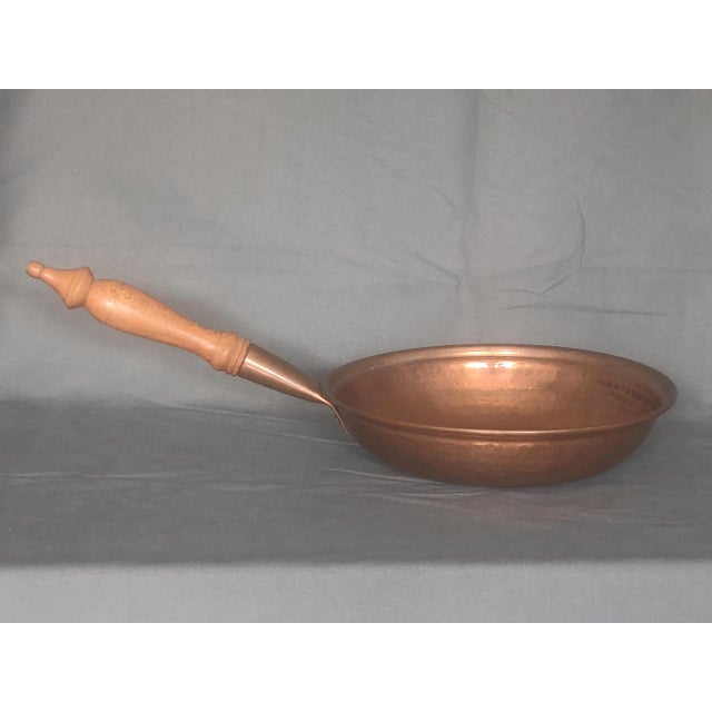 This listing is for a Vintage Copper Frying Pan with Wood Handle. It is does not have any company markings that I can...