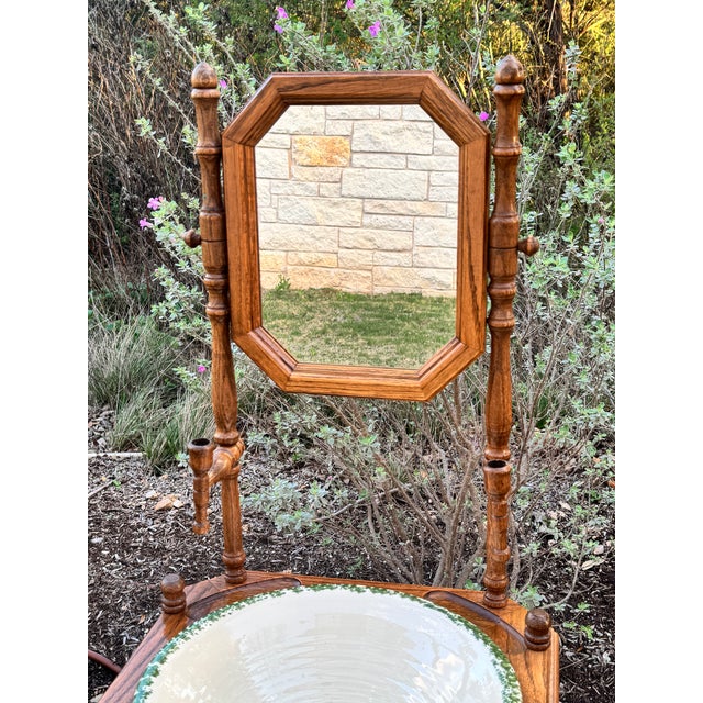 Vintage Victorian style oak washstand with a mirror and barley twist legs. Historically used as a personal wash station...