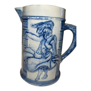 Embossed Blue and White Stoneware Pitcher by Robinson Pottery Company.
