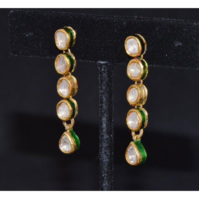 Gorgeous 22K solid gold diamond dangle earrings accented with vibrant enamel work. These stunning vintage earrings feature...