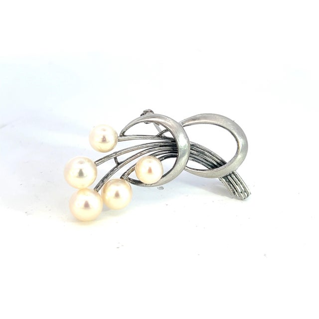 Mikimoto Estate Akoya Pearl Brooch 6.80 mm Silver M374 This elegant Authentic Mikimoto Silver brooch has 5 Saltwater Akoya...