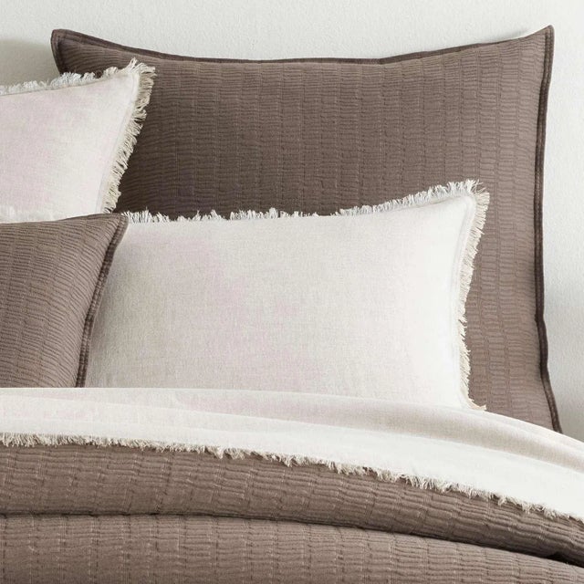 With its tempting texture and sensuous feel, the rhythmical, irregular design of this cotton matelassé sham conjures...