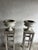 A beautiful pair of antique cast stone garden urns with a heavily weathered patina and classical decorative detailing....