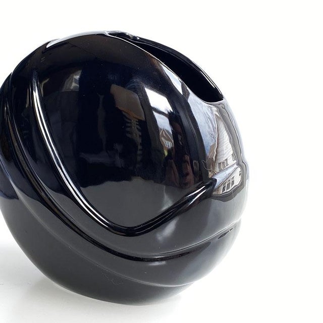 Golden Girls fans unite. This round black glazed ceramic vase harkens to the 1980s and welcomes incorporated the old with...