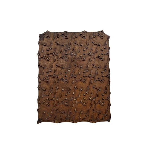 An impressive antique hand-carved wooden printing block featuring an intricate repeating floral and geometric pattern....
