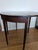 This family heirloom antique has intricate George III oval inlay work. Collapses to demi lune - a truly beautiful piece.