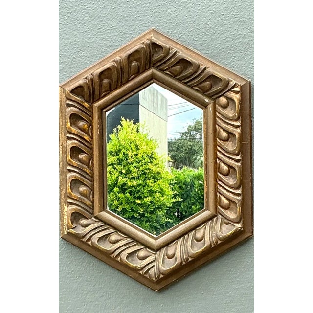 This vintage Italian hexagonal carved wood mirror brings architectural character and warm Old World detail to the room....