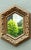 This vintage Italian hexagonal carved wood mirror brings architectural character and warm Old World detail to the room....