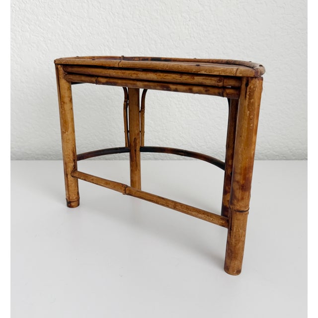 Vintage 1970s demi half circle shaped riser, pedestal, or plant stand made of bamboo & rattan, with burnt tortoise finish....