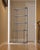 Dimensions: 24"W × 11.75"D × 59"H Shelf depths: Lower two 11 3/8"D; upper three 7 3/8"D Sculptural “Isocèle” étagère...