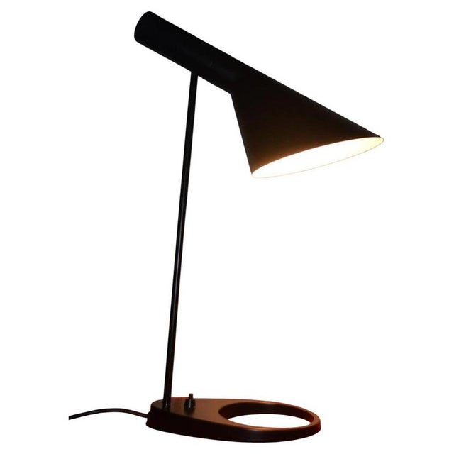 An iconic aj table lamp designed by arne jacobsen for louis poulsen, denmark, dating to the 1960s and representing one of...