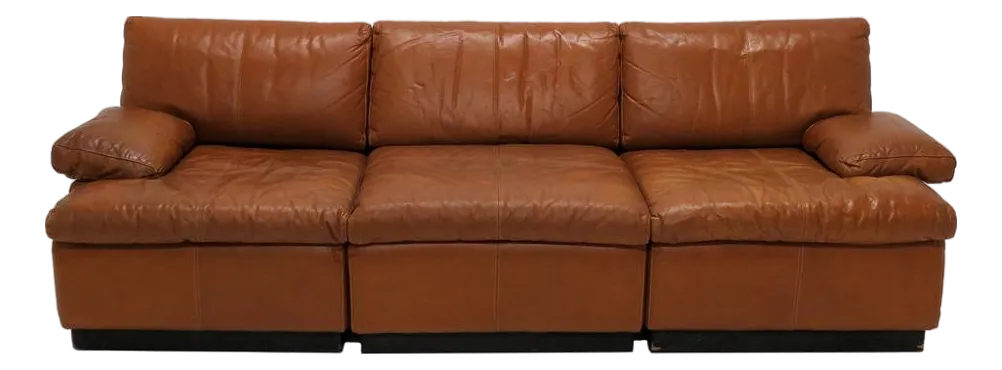 Front view of a brown leather modular sofa.