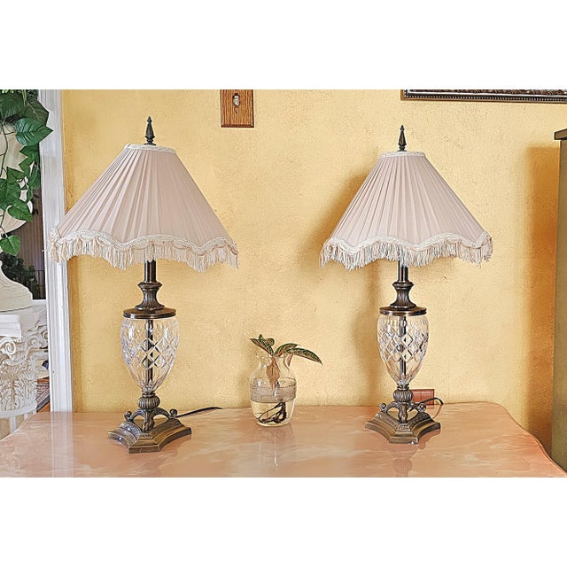 This beautiful pair of vintage table lamps features cut crystal bodies with an intricate diamond pattern, complemented by...