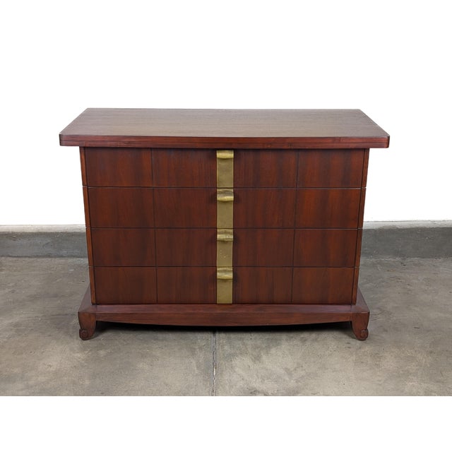 Striking Vintage Art Deco lowboy chest of drawers by Widdicomb, dating to the 1930s. This exceptional piece showcases the...