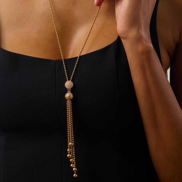 This elegant Cartier Draperie de Decollete lariat necklace showcases a graceful and fluid design, set with 113 round...