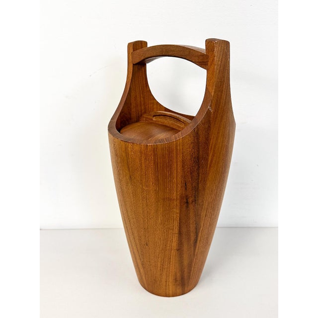 This wonderful vintage Dansk teak ice bucket is a classic and collectible mid-century modern barware piece. The warm teak...