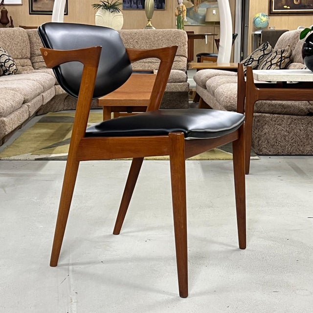 An exceptional set of six Model 42 dining chairs designed by Kai Kristiansen, one of the defining figures of Danish mid-...