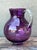 Pour a glass of vibrant sophistication with this stunning vintage hand-blown art glass pitcher. The vessel features a...