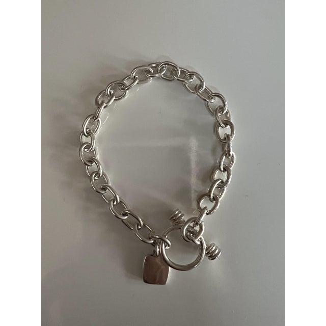 Mid 20th Century Chunky Sterling Silver Link Bracelet Featuring a Classic Tibetan Toggle Clasp and a Square Heart-Accented Charm For Sale - Image 5 of 6