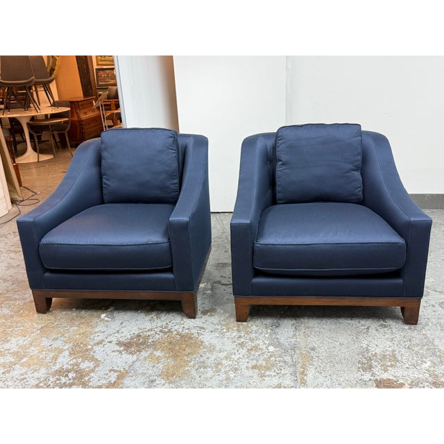 Design Plus Gallery presents a Pair of the Neue Lounge Chairs by Laura Kirar for Baker Furniture. Upholstered in navy blue...