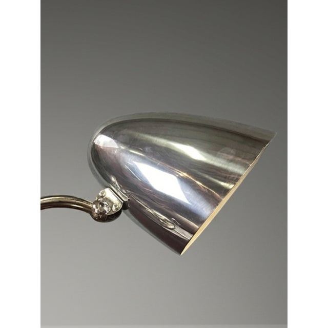 A refined 1930s table lamp with a clean functional form and subtle Art Deco influence. The adjustable construction adds...