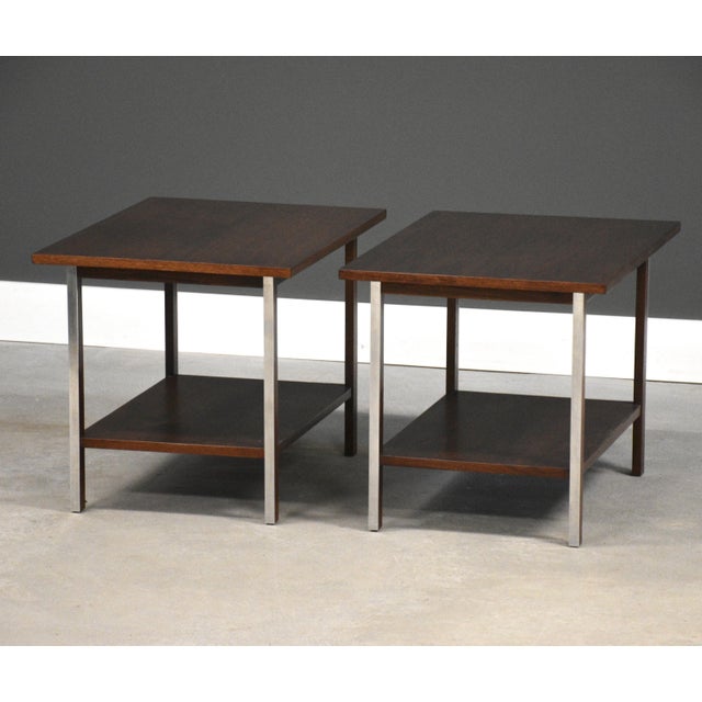 A pair of mid century modern walnut and polished aluminum end tables designed by Paul McCobb for Calvin. Circa 1960’s....