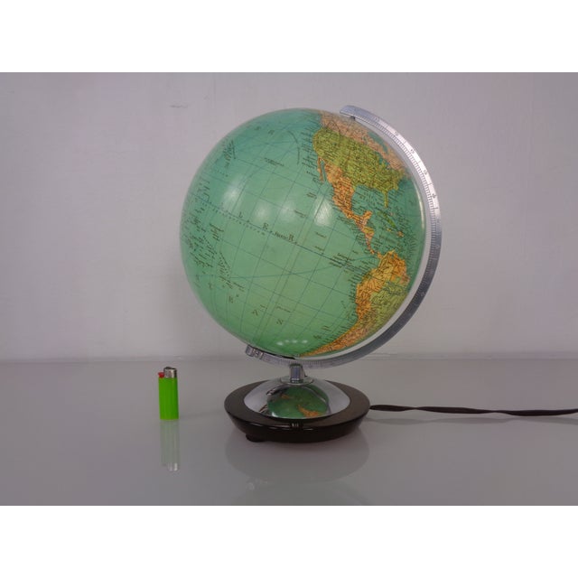 Small Columbus globe by Paul Oestergaard from the 1960s. Physically illuminated, glass, hand-laminated. Solid walnut wood...