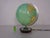 Small Columbus globe by Paul Oestergaard from the 1960s. Physically illuminated, glass, hand-laminated. Solid walnut wood...
