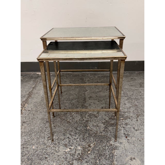 Design Plus Gallery presents a Set of Two Nesting Tables from Restoration Hardware. Each table has an inset mirrored top...