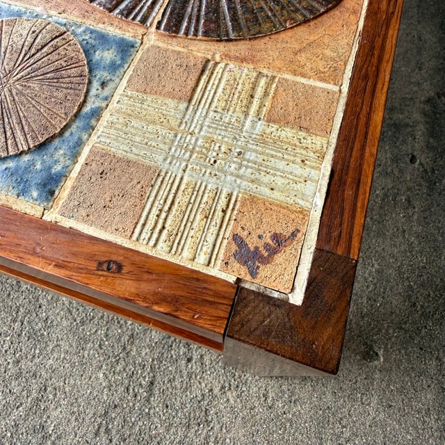 Tue poulsen tile top coffee table with rosewood frame.