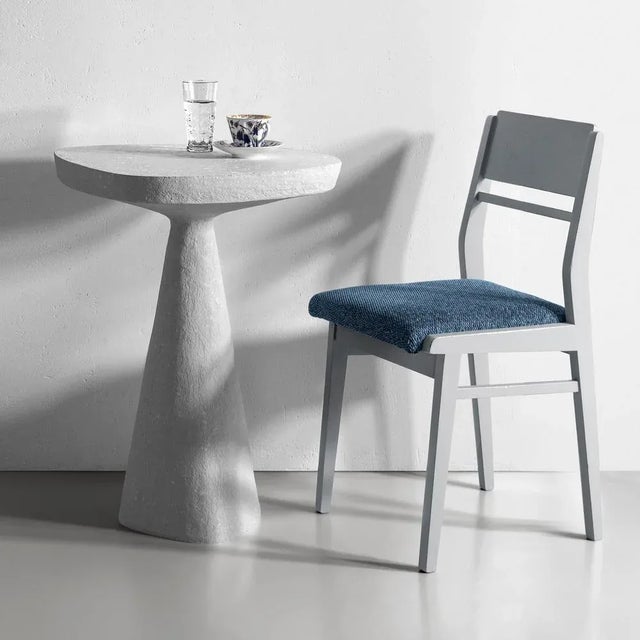 Table "plinth column" plinth is a sculptural table defined by a strong architectural presence and refined proportions. Its...