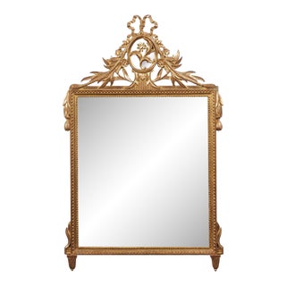 Louis XVI Style Gilt Wood Mirror with Floral Carved Medallion Crest and Tassels For Sale