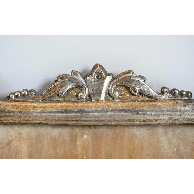 This small pair of antique, Indian silver frames was hand crafted with crossed supporting members. The frames feature...