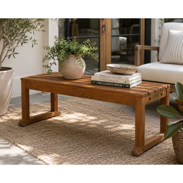 Well-crafted teak garden bench by Barlow Tyrie of Braintree, England, a renowned maker of fine outdoor furniture since the...