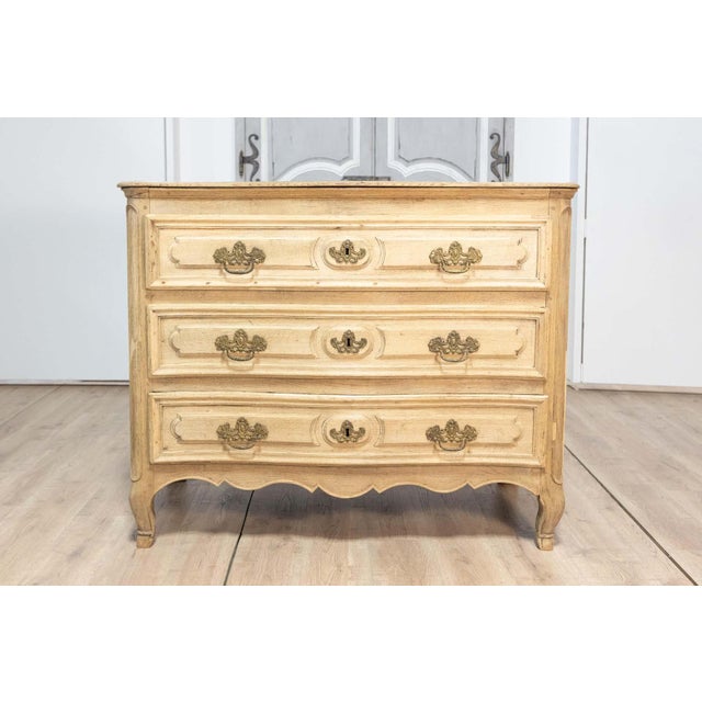 This exquisite 18th-century French commode epitomizes the timeless elegance and craftsmanship of the Louis XV period....