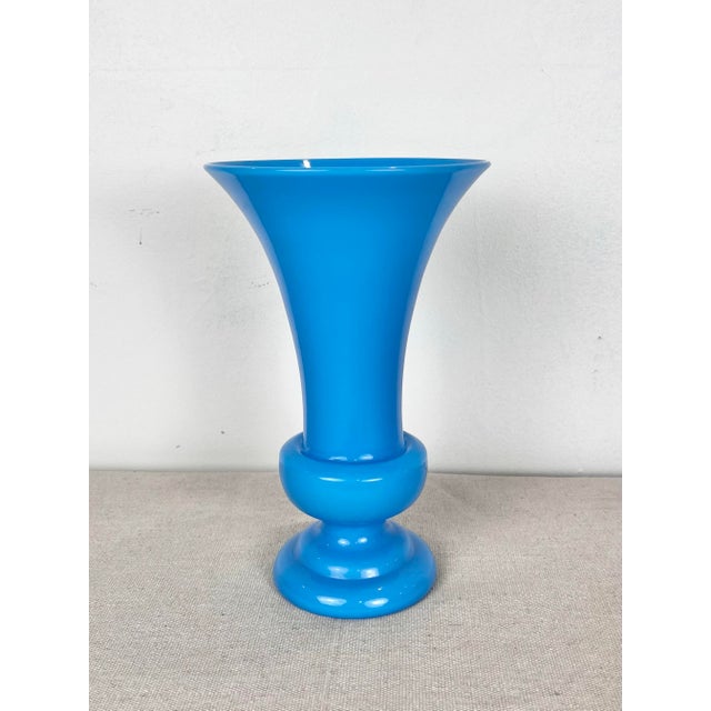 Vintage blue opaline glass vase. Radiant turquoise blue glass in a classic shape.