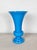 Vintage blue opaline glass vase. Radiant turquoise blue glass in a classic shape.