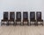 An exceptional set of six 19th century Spanish dining chairs featuring richly aged leather upholstery and beautifully...