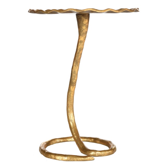 This contemporary sculptural side table was created for the design collector. its gold finish highlights each dramatic...