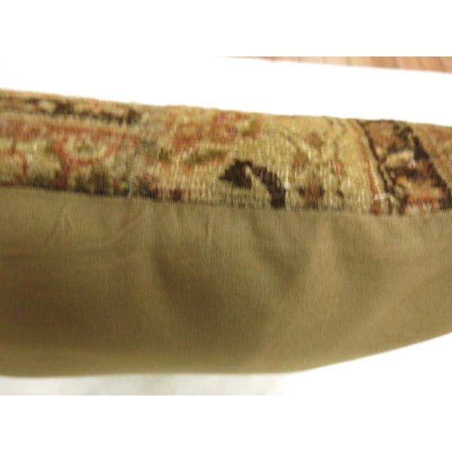 Pillow made from a 20th century Persian Tabriz rug made in a patchwork format in rustic tones Measures: 20'' x 20".