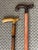Vintage pair of estate walking canes, each with their own rustic folk art features. An excellent pair to add to or to...